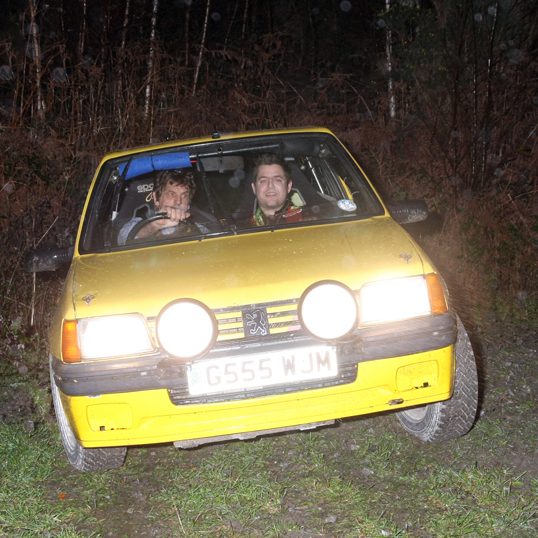 Paul Watts / Liam Burns in Yellow Peugoet 205 road rally car