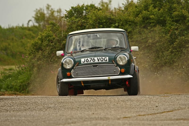 Green Classic Mini rally car in action on the TSH Stages at Portreath - South Hams Motor Club